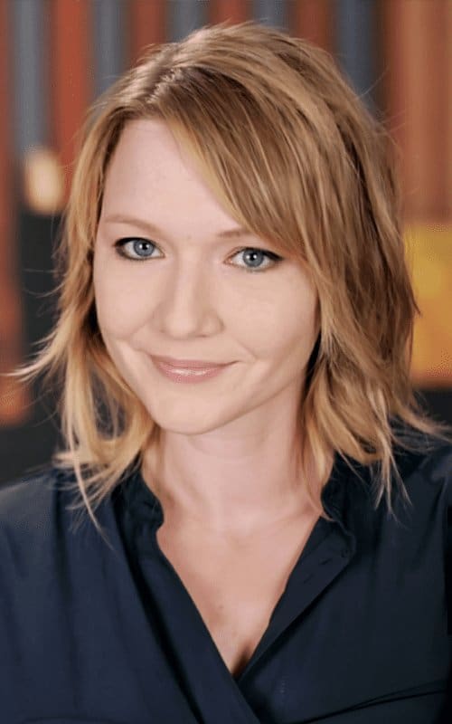 Michelle M. Pillow headshot with bookshelf background, NYT bestselling romantasy author